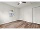 Bedroom with window, wood-look flooring, and double door closet at 647 Simpson St, Rock Hill, SC 29730