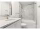 Bathroom with marble tile shower/tub combo and white vanity at 647 Simpson St, Rock Hill, SC 29730