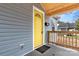 Eye-catching yellow front door with a wood-framed porch at 647 Simpson St, Rock Hill, SC 29730