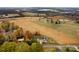 Aerial view of home on spacious lot with surrounding fields at 6650 Long Branch Rd, Salisbury, NC 28147