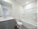 Clean bathroom with a bathtub, toilet and vanity with a quartz countertop at 913 Smithcliffs Trl, York, SC 29745