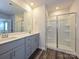 Double vanity bathroom with a large shower and modern gray cabinets at 913 Smithcliffs Trl, York, SC 29745