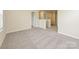 Spacious carpeted bedroom with access to a hallway and bathroom at 913 Smithcliffs Trl, York, SC 29745