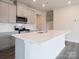 Contemporary kitchen featuring gray cabinets and a large kitchen island at 913 Smithcliffs Trl, York, SC 29745