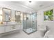 Modern bathroom with double vanity, walk-in shower, and elegant gold fixtures at 200 Kimrod Ln, Charlotte, NC 28270