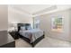 Bright bedroom with carpeted floors and a double bed at 2016 Tupelo Grove Ln, Gastonia, NC 28054