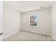 Bright bedroom with neutral walls and carpet at 2016 Tupelo Grove Ln, Gastonia, NC 28054