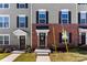 Townhouse exterior featuring brick and siding at 2016 Tupelo Grove Ln, Gastonia, NC 28054