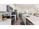 Modern kitchen with white cabinets, stainless steel appliances, and an island at 2016 Tupelo Grove Ln, Gastonia, NC 28054