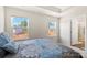 Well-lit bedroom with two windows showcasing a view and access to a bathroom at 2016 Tupelo Grove Ln, Gastonia, NC 28054