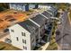 Aerial view of row of townhomes from street at 2016 Tupelo Grove Ln, Gastonia, NC 28054