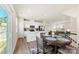 Open concept kitchen and dining area with modern white cabinets and stainless steel appliances at 2016 Tupelo Grove Ln, Gastonia, NC 28054