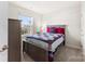 Well-lit bedroom featuring a comfortable bed and dresser at 2016 Tupelo Grove Ln, Gastonia, NC 28054
