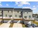 Aerial view showcasing townhomes, decks, and garages at 2016 Tupelo Grove Ln, Gastonia, NC 28054
