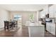 Modern kitchen with white cabinets, stainless steel appliances, and island at 2016 Tupelo Grove Ln, Gastonia, NC 28054