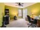 Bright bedroom with a desk, window, and carpeted floor at 4511 Belmar Place Rd, Charlotte, NC 28269