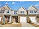 Three-unit townhouse building with attached garages at 6259 Tea Olive Dr # 178, Harrisburg, NC 28075