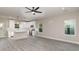 Modern kitchen with island, white cabinets, and gray flooring at 1412 10Th St, Statesville, NC 28677