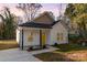 Newly built home with yellow door and small porch at 1412 10Th St, Statesville, NC 28677