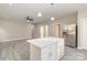 Open concept kitchen with island and stainless steel appliances at 1412 10Th St, Statesville, NC 28677
