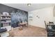 Bright bedroom or office with a chalkboard accent wall and built-in shelving at 1628 Savory Ln, Charlotte, NC 28216