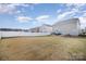 Spacious backyard with grassy area and privacy fence at 1628 Savory Ln, Charlotte, NC 28216