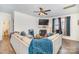Spacious living room with sectional sofa, fireplace, and large TV at 1628 Savory Ln, Charlotte, NC 28216