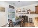 Kitchen features dark wood cabinets, granite counters, and a breakfast bar at 1628 Savory Ln, Charlotte, NC 28216