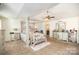 Luxurious main bedroom with a four-poster bed and en-suite bathroom at 1628 Savory Ln, Charlotte, NC 28216
