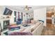Open living space with sectional sofa, fireplace, and kitchen view at 1628 Savory Ln, Charlotte, NC 28216