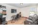 Bright home office featuring a desk, chair, and comfortable seating at 1628 Savory Ln, Charlotte, NC 28216