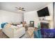 Living room boasts a sectional sofa, fireplace, and large screen TV at 1628 Savory Ln, Charlotte, NC 28216