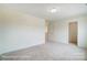 Well-lit bedroom with carpeted floors and a closet at 5112 Heathland Dr # 75, Charlotte, NC 28215