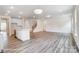 Open concept living room with hardwood floors and stairs at 5112 Heathland Dr # 75, Charlotte, NC 28215