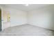 Well-lit bedroom with carpeted floors and access to a bathroom at 5112 Heathland Dr # 75, Charlotte, NC 28215