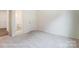 Bedroom with private bathroom access and neutral carpet at 5112 Heathland Dr # 75, Charlotte, NC 28215