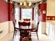 Bright breakfast nook with bay window and charming decor at 5486 Kershaw Camden Hwy, Heath Springs, SC 29058