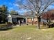 Back exterior view of home with patio and fenced area at 5486 Kershaw Camden Hwy, Heath Springs, SC 29058