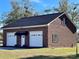 Detached brick two-car garage with extra storage at 5486 Kershaw Camden Hwy, Heath Springs, SC 29058