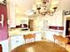 Kitchen with white cabinets, and a breakfast bar at 5486 Kershaw Camden Hwy, Heath Springs, SC 29058