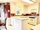 Galley kitchen with white cabinets, and modern appliances at 5486 Kershaw Camden Hwy, Heath Springs, SC 29058
