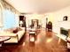 Bright living room with hardwood floors and fireplace at 5486 Kershaw Camden Hwy, Heath Springs, SC 29058