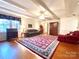 Spacious living room with hardwood floors and a fireplace at 5486 Kershaw Camden Hwy, Heath Springs, SC 29058