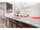 Kitchen island with granite countertop and double sink at 10002 Brittondale Ln, Charlotte, NC 28215