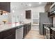 Kitchen with dark cabinets, granite countertops, and stainless steel appliances at 10002 Brittondale Ln, Charlotte, NC 28215