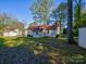 Backyard with two sheds and trees at 22 Henry Ave, Belmont, NC 28012