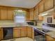 Cozy kitchen with ample counter space and wood cabinets at 22 Henry Ave, Belmont, NC 28012