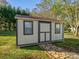 Well-maintained storage shed with stone path at 22 Henry Ave, Belmont, NC 28012