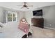 Bright bedroom with carpeted floors, a ceiling fan, and large windows at 2741 Smethwick Ln, Gastonia, NC 28056