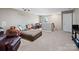 Relaxing media room featuring a leather couch and ottoman at 2741 Smethwick Ln, Gastonia, NC 28056